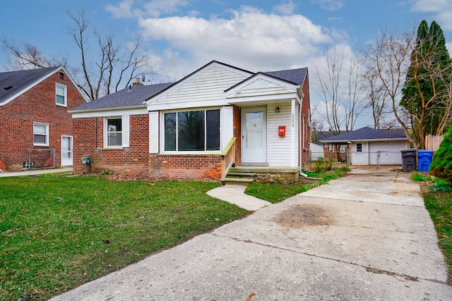 bungalow-style house with a front yard