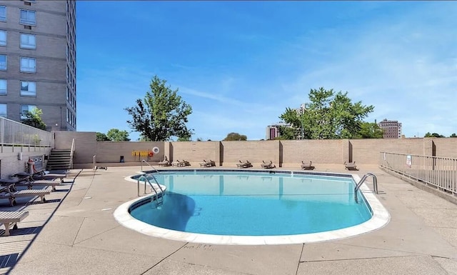 view of swimming pool with a patio area