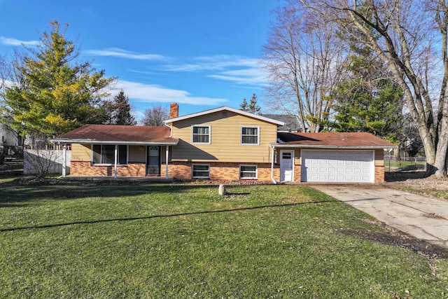 6058 Meadowwood Ln, Grand Blanc, MI 48439 - tri-level home featuring a garage and a front yard