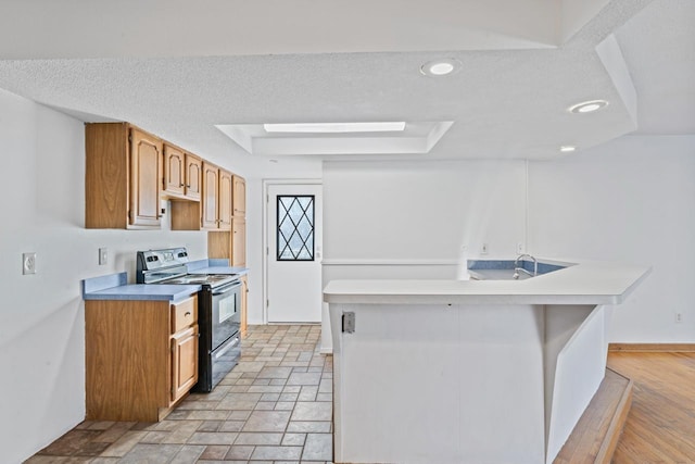 6058 Meadowwood Ln, Grand Blanc, MI 48439 - kitchen with electric range, a textured ceiling, and light hardwood / wood-style flooring