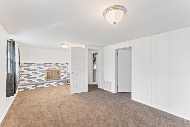 6058 Meadowwood Ln, Grand Blanc, MI 48439 - interior space with dark carpet and a fireplace