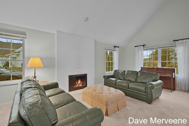 living room featuring high vaulted ceiling, light colored carpet, and a brick fireplace