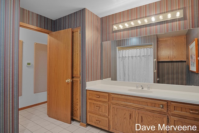 bathroom featuring tile patterned flooring, vanity, and a shower with curtain