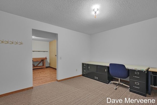 office space with wood-type flooring and a textured ceiling