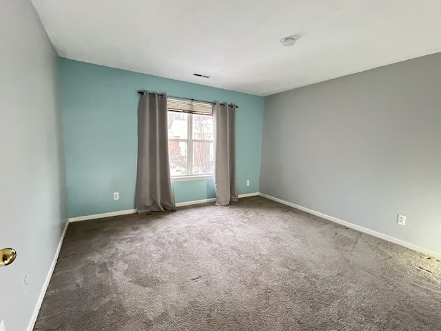 empty room with carpet flooring