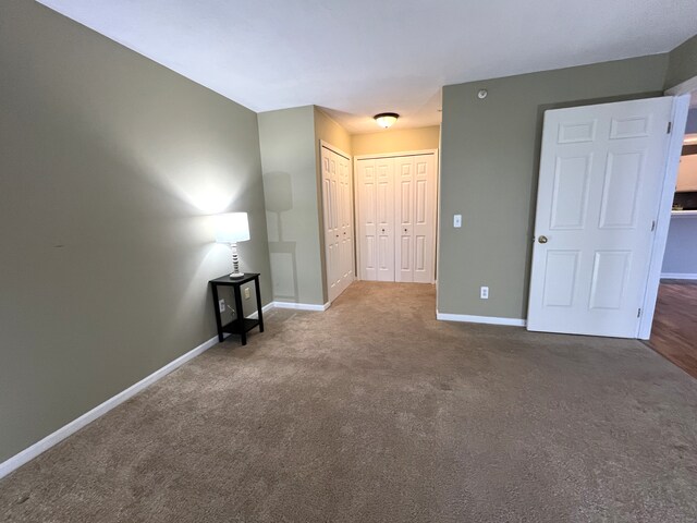 unfurnished room with carpet flooring