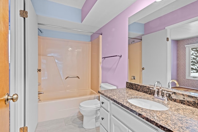 full bathroom featuring tile patterned floors, vanity, toilet, and tub / shower combination