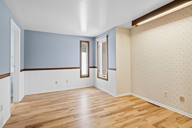 spare room featuring light hardwood / wood-style floors