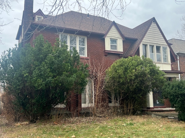 view of home's exterior with a yard