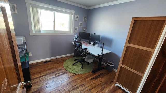 home office with dark hardwood / wood-style floors and crown molding