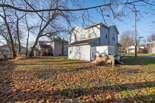 view of property exterior with a lawn