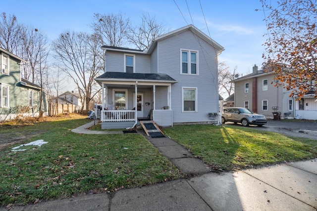 view of front of home with a front lawn and covered porch