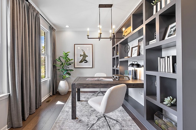 office featuring crown molding, dark wood-type flooring, and a notable chandelier