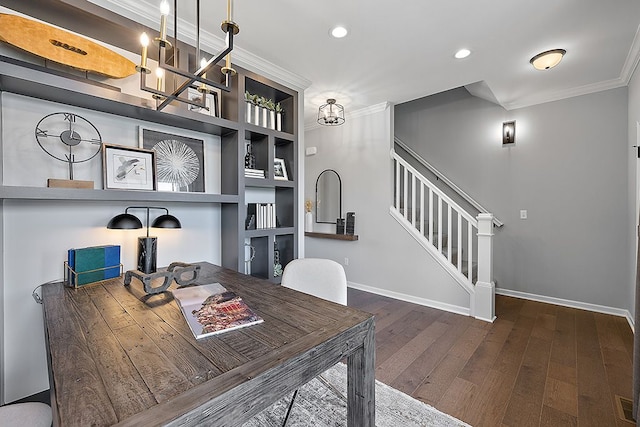 dining space featuring crown molding and dark wood-type flooring