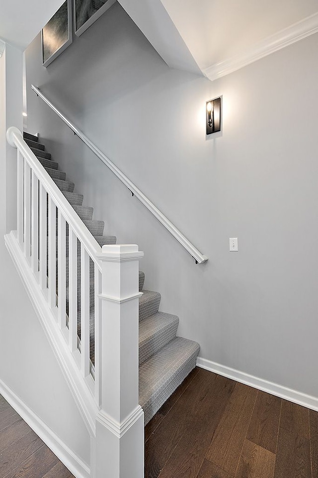 stairway featuring hardwood / wood-style flooring