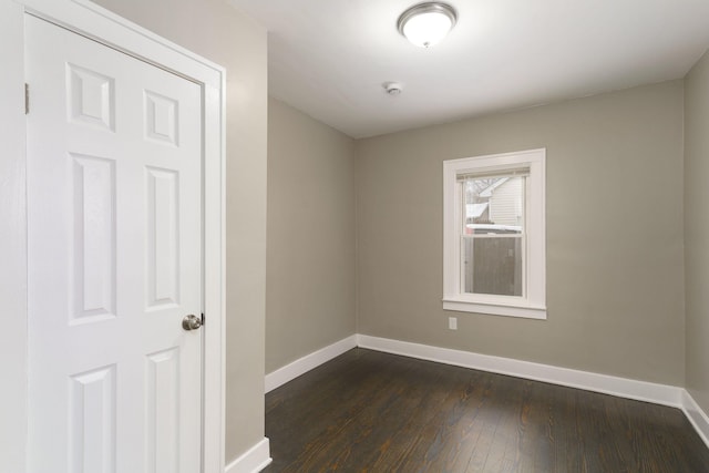 spare room featuring dark hardwood / wood-style floors