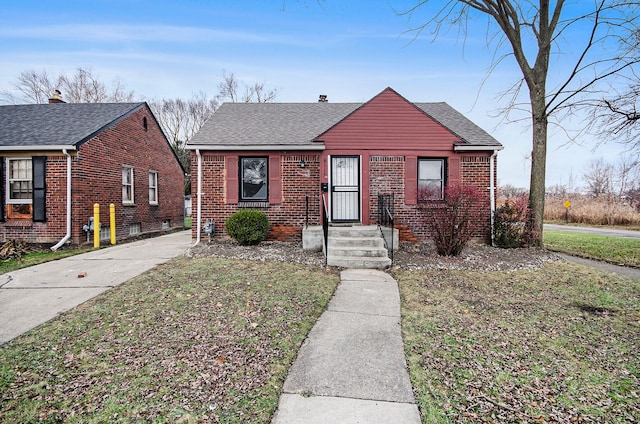 bungalow with a front lawn