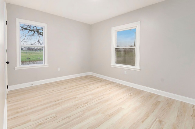 unfurnished room featuring light hardwood / wood-style floors