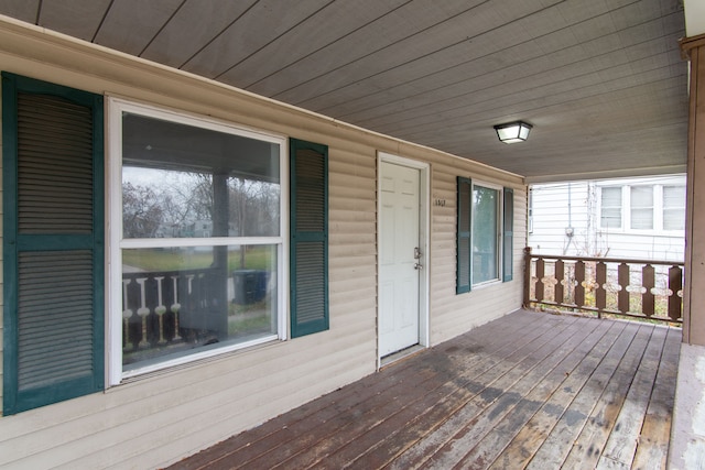 wooden deck featuring covered porch