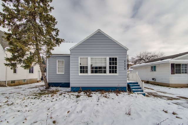 view of snow covered house