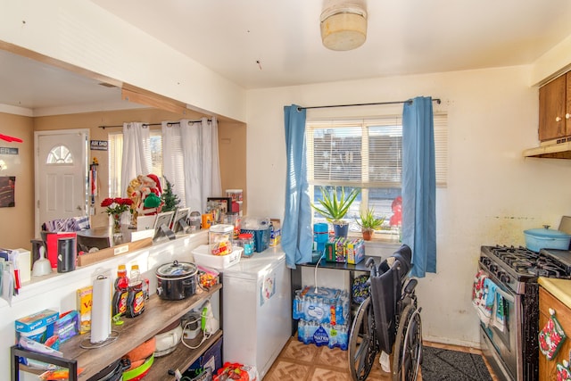 kitchen featuring gas stove and extractor fan