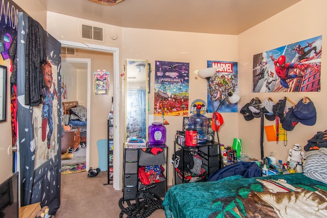 bedroom featuring light carpet