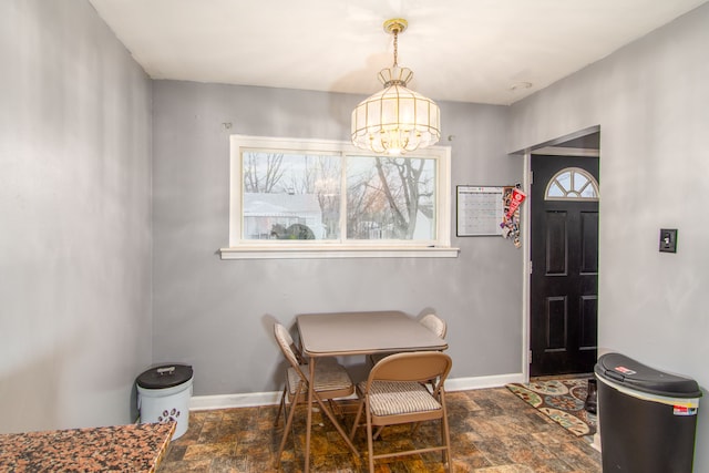 dining area featuring an inviting chandelier