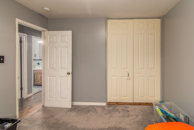 carpeted bedroom featuring a closet