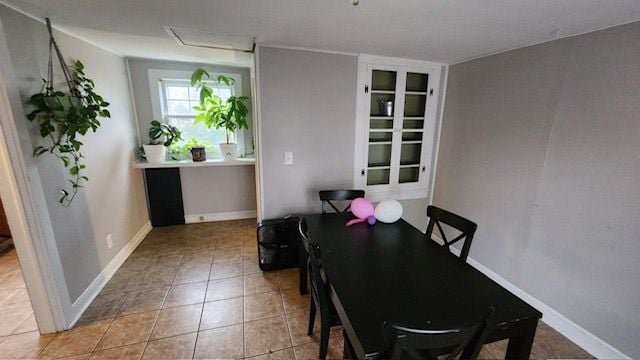 dining space featuring light tile patterned floors