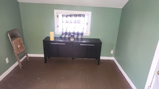 office area featuring dark wood-type flooring