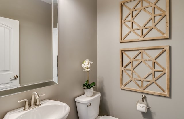 bathroom with sink and toilet