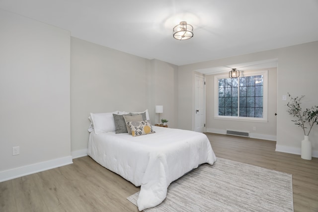 bedroom with hardwood / wood-style flooring