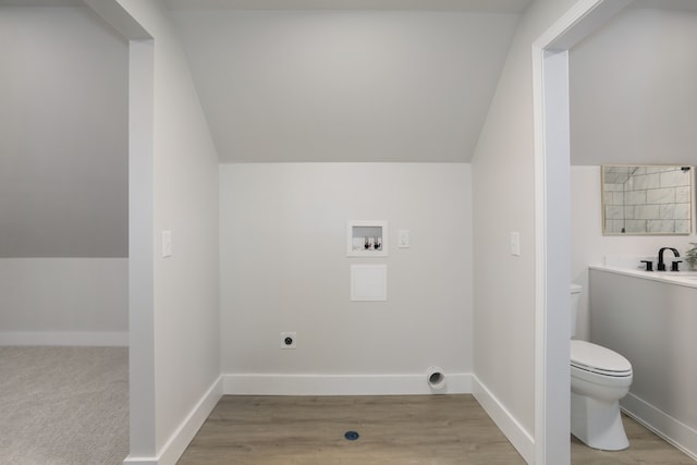 laundry room featuring electric dryer hookup, light hardwood / wood-style flooring, washer hookup, and sink