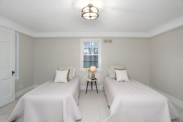 bedroom featuring light carpet