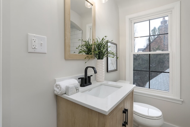 bathroom with vanity and toilet