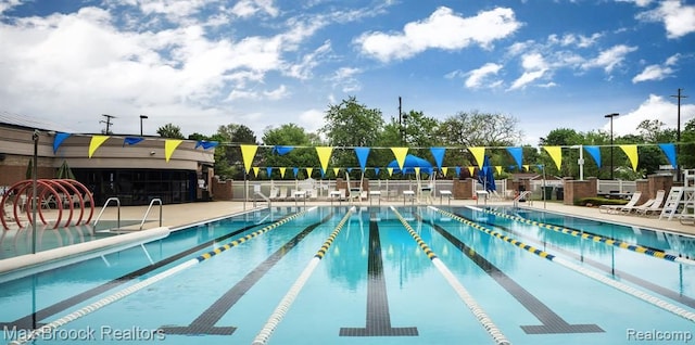 view of swimming pool featuring a patio