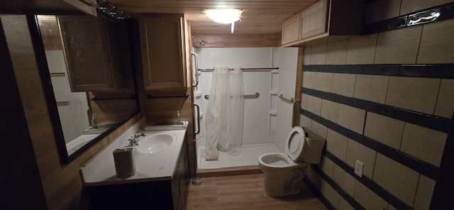 bathroom featuring wooden ceiling, a shower with curtain, sink, toilet, and wood-type flooring