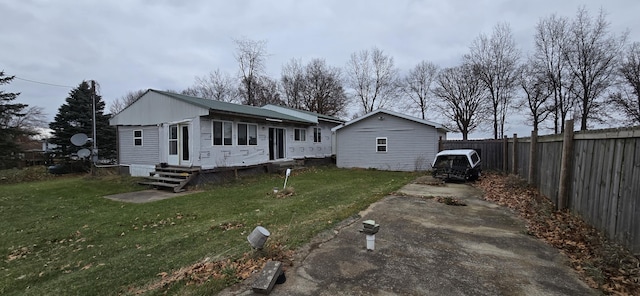 rear view of property featuring a yard