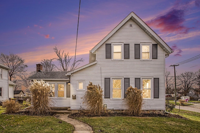 view of front of home with a yard