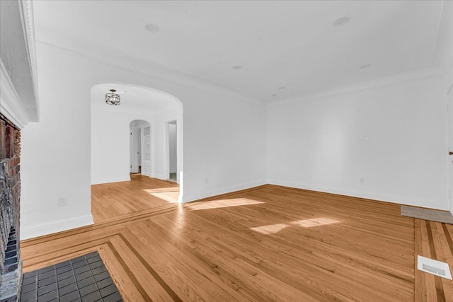 unfurnished living room featuring hardwood / wood-style flooring