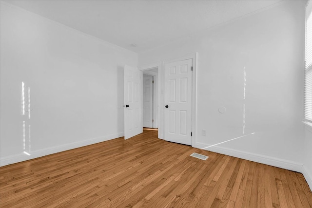 unfurnished room with light hardwood / wood-style flooring