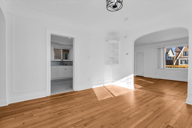 interior space featuring sink and light hardwood / wood-style floors