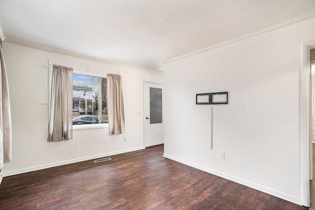 unfurnished room with dark hardwood / wood-style flooring and crown molding