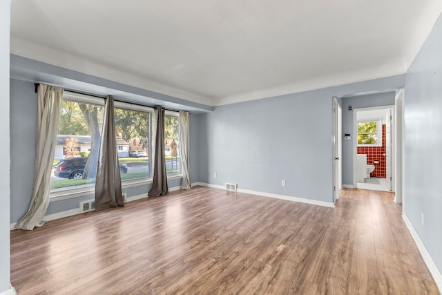 spare room with hardwood / wood-style flooring