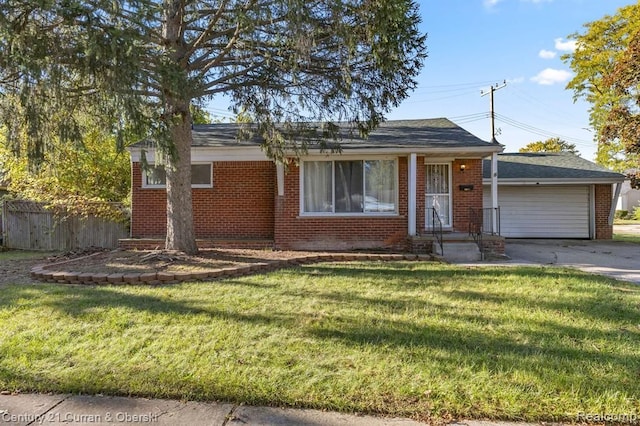 view of front facade with a garage and a front yard