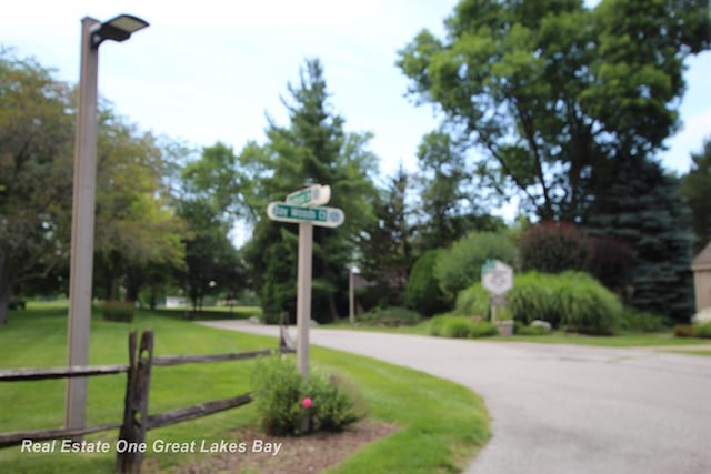 2377 Bay Woods Ct, Bay City, MI 48706 - view of asphalt road featuring street lighting