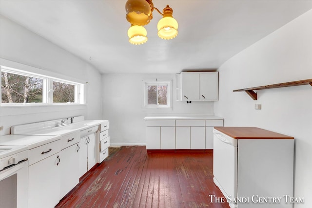 kitchen featuring dark hardwood / wood-style flooring, white cabinets, white appliances, and sink