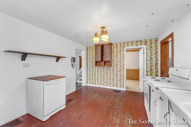 kitchen with white cabinetry, dark hardwood / wood-style floors, and white appliances