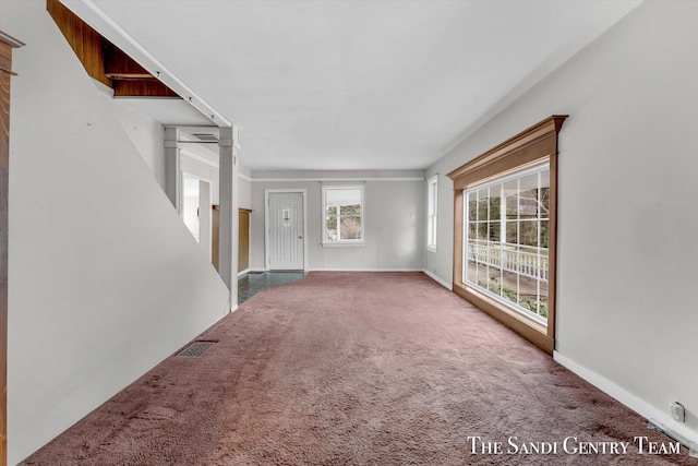 unfurnished living room with carpet