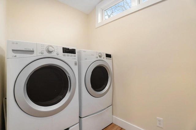 washroom with separate washer and dryer